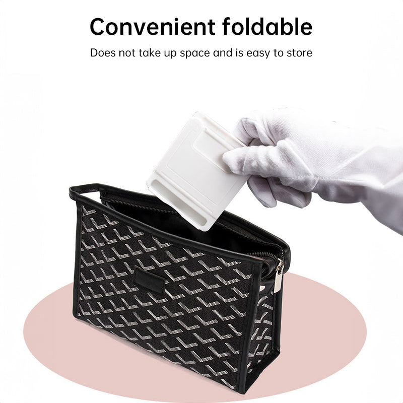 A plastic, foldable cradle for mobile phones